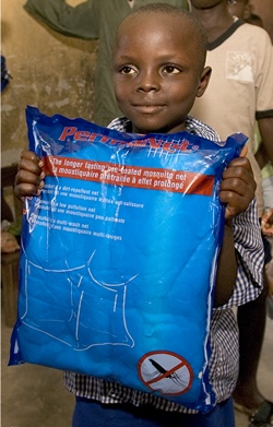 A child receives an anti-malaria net