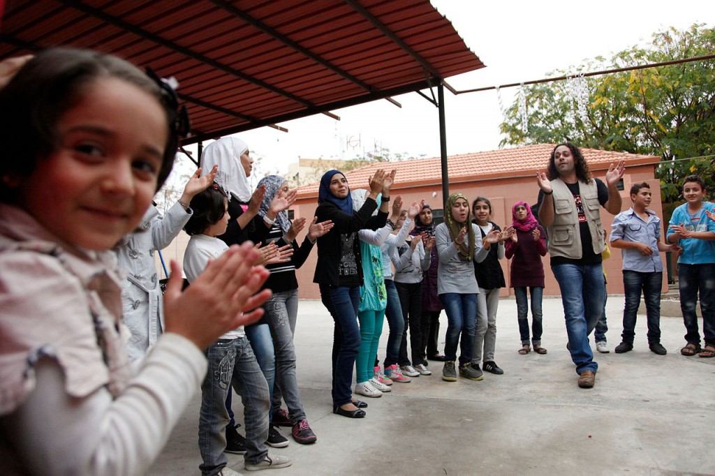 Syrian children play games at a social centre in northern Lebanon run by War Child Holland and UNICEF
