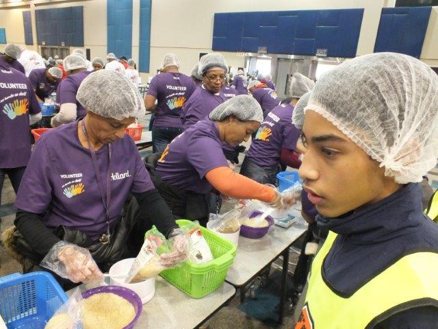 Hollard volunteers participate in a food‑packaging event in celebration of Nelson Mandela Day, in partnership with Stop Hunger Now.