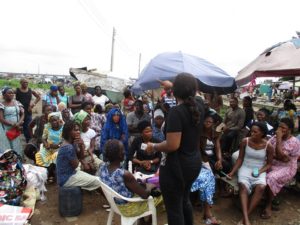 Ibezim-Ohaeri addresses a group of displaced residents in Badia, Lagos.