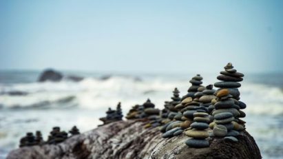 patience as depicted by carefully arranged pebbles on the shore